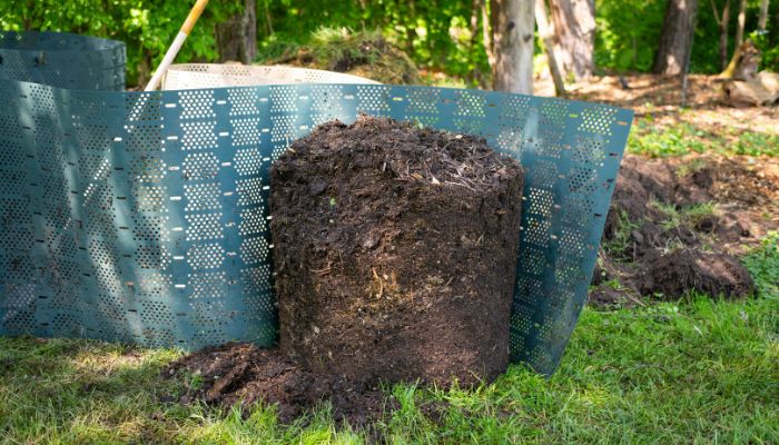 opened geobin composter showing finished compost