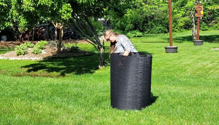 woman setting up geobin composter